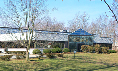 Modern single-story commercial building with landscaping